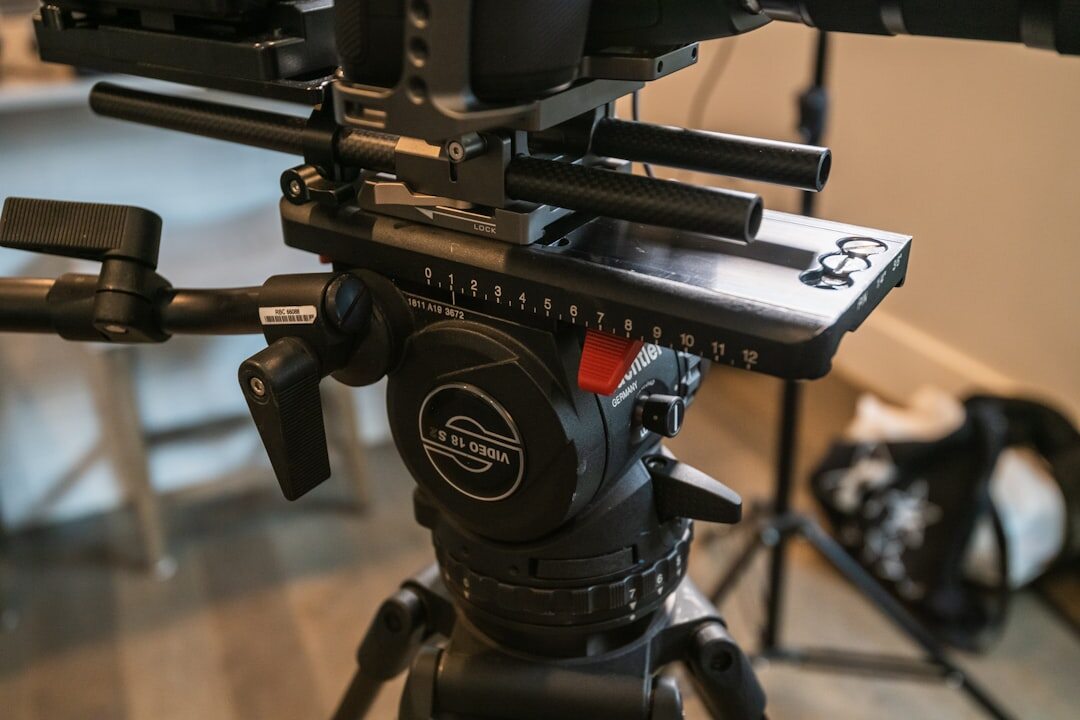 Professional broadcast camera on tripod in studio