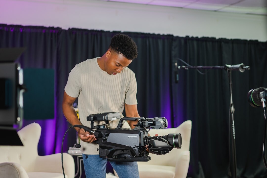 Broadcast professional reviewing studio configuration on computer